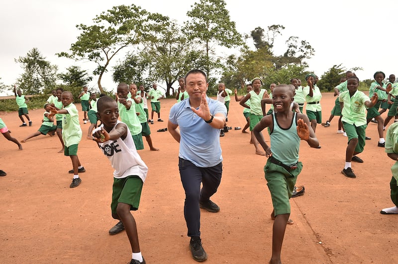 Chinese martial arts teacher Liu Wei practices with students of the Fourah Bay College Secondary School in Freetown during a training session at the Confucius Institute University of Sierra Leone on Oct. 15, 2024.