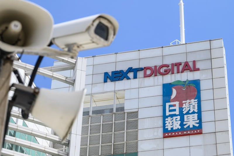 Signage for Next Digital and Apple Daily are seen displayed outside the offices of the the offices of the local Apple Daily newspaper in Hong Kong , June 17, 2021. Credit: AFP