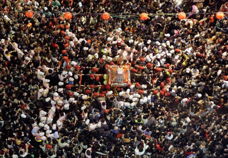 Worshipers carry a statue of the goddess Matsu during the annual pilgrimage in Taichung, Taiwan, in 2010. (Pichi Chuang/Reuters)