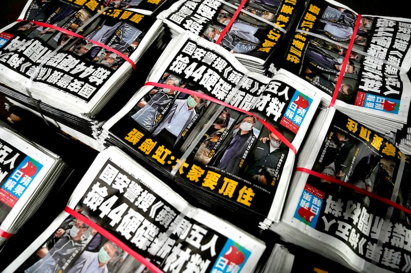 Bundled copies of Hong Kong's Apple Daily, which sold briskly a day after the pro-democracy newspaper was raided by national security police and several of its top executives arrested under the national security law, June 18, 2021. Credit: AP