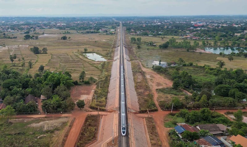 A train on the Laos-China Railway passes through a suburb of Vientiane, Laos, Nov. 28, 2022. Credit: Kaikeo Saiyasane/Xinhua via Getty Images