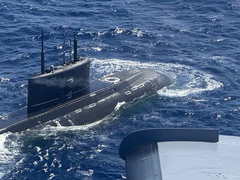 A Russian Kilo-class submarine UFA 490 is spotted 80 nautical miles from Mindoro island in the disputed South China Sea  Nov. 28, 2024. Foreground right is the Philippines surveillance plane.