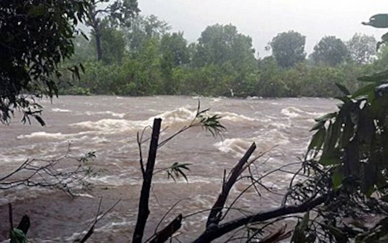 Floodwaters stream through southern Cambodia's Kampot province, Sept. 17, 2015.