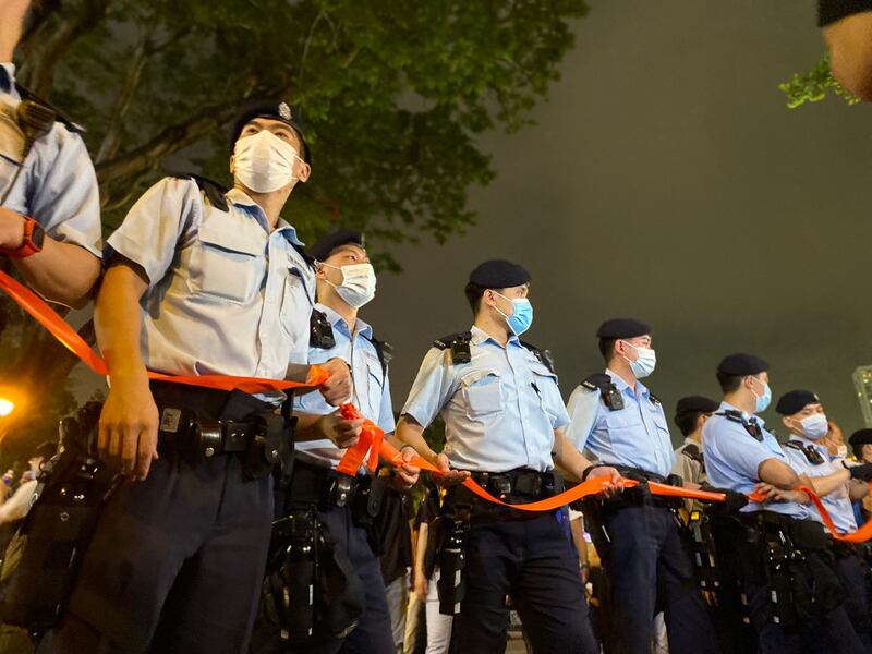 A phalanx of Hong Kong police prevent people from gathering to honor those who died on June 4, 1989 when China's military put down student-led pro-democracy protests, June 4, 2021. Credit: RFA