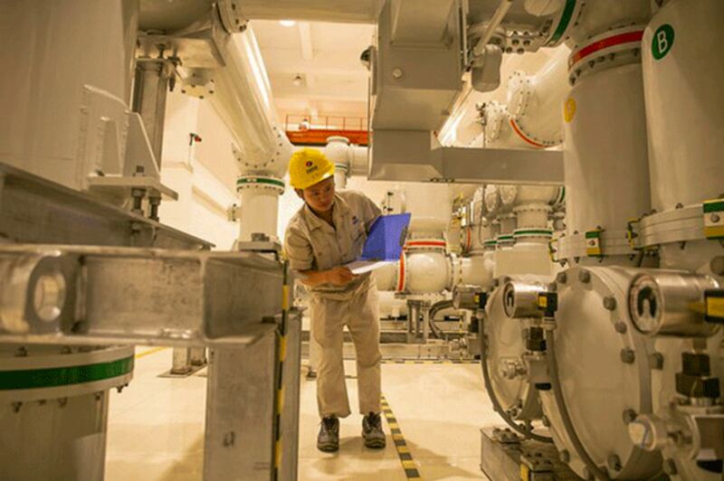 A staff member of PowerChina works at the Nam Ou 7 hydropower plant on the Nam Ou River in northern Laos' Phongsaly province, Sept. 27, 2022. (Kaikeo Saiyasane/Xinhua via Getty Images)