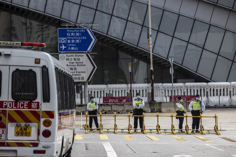 Police guard a closed road outside the West Kowloon station in Hong Kong on June 30, 2022, after Chinese President Xi Jinping arrives in Hong Kong to celebrate the 25th anniversary of the handover of Hong Kong from Britain to China taking place on July 1. Credit: AFP