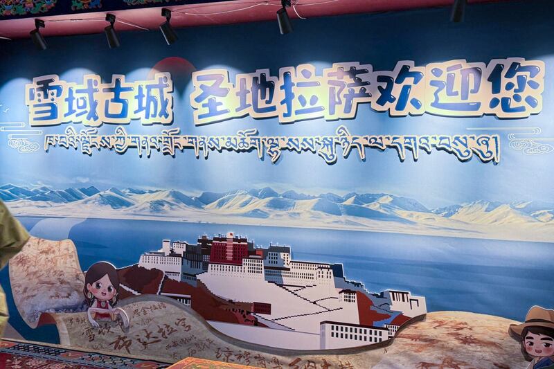 A sign and image of Potala Palace at Lhasa Gonggar International Airport welcomes tourists to Tibet’s capital Lhasa in November 2024.