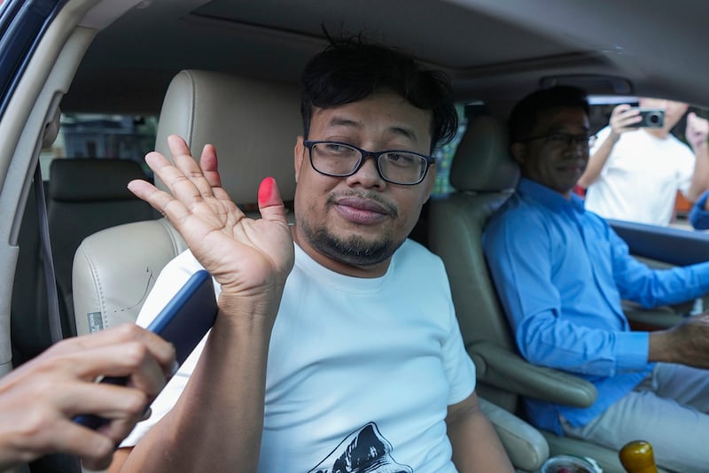 Cambodian freelance journalist Mech Dara waves after his release from prison in Kendal province, Cambodia, Oct. 24, 2024.