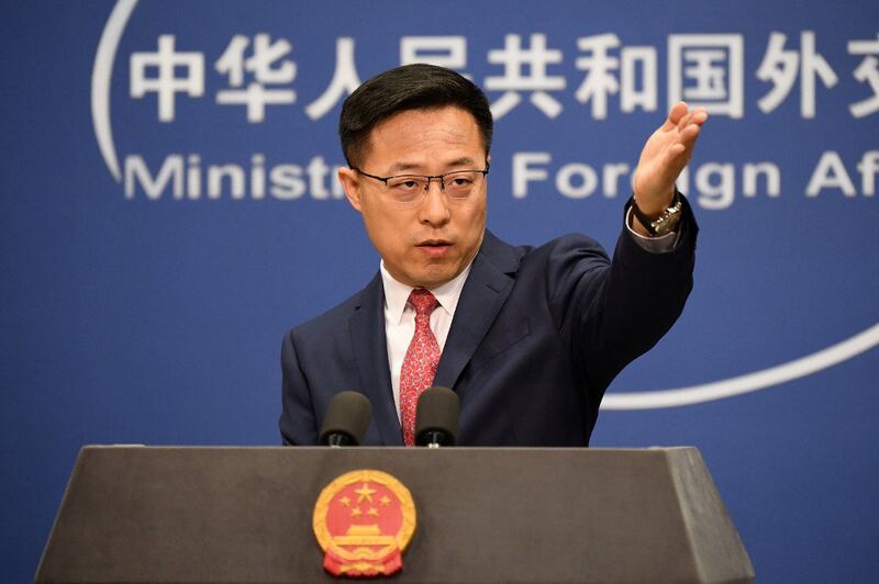 Chinese Foreign Ministry spokesman Zhao Lijian, seen in a file photo of a daily media briefing in Beijing on April 8, 2020, has repeatedly been called out for spreading conspiracy theories about the coronavirus, Afghanistan and other controversial topics.