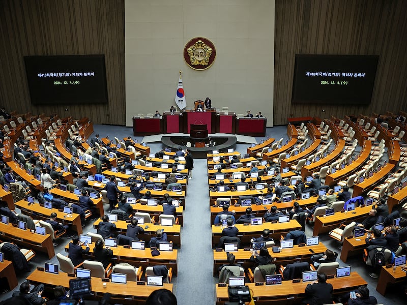 Lawmakers sit inside the hall at the National Assembly, after South Korean President Yoon Suk Yeol declared martial law, in Seoul, Dec. 4, 2024.