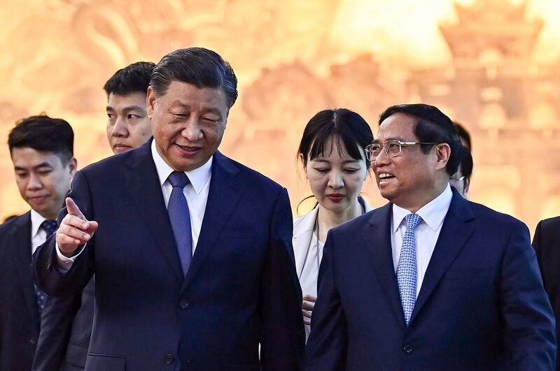 Vietnam's Prime Minister Pham Minh Chinh and China's President Xi Jinping, following a meeting at the Government Office in Hanoi, Dec. 13, 2023. (Nhac Nguyen/Pool Photo via AP)