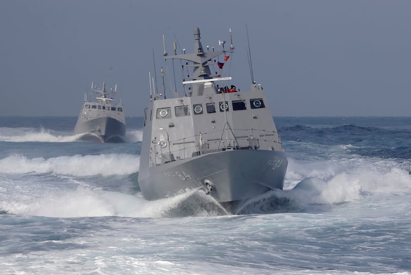 Two Taiwanese Kuang Hua VI-class missile boats conduct a simulated attack drill off Kaohsiung City, southern Taiwan, Jan. 9, 2025.