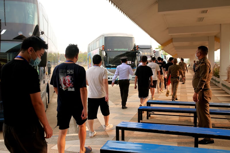 Alleged scam center workers and victims from China arrive at the Thai-Myanmar border checkpoint in Myanmar's Myawaddy township on Feb. 20, 2025.