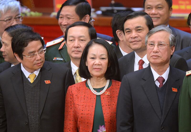 Politburo member Truong Thi Mai, in red, stands on the podium at the closing ceremony of the Vietnamese Communist Party national congress in Hanoi, Jan. 28, 2016. (Hoang Dinh Nam/Pool Photo via AP)