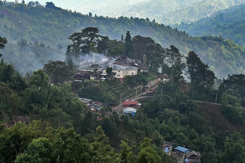 Smoke rises from a burning Myanmar military compound amid clashes with armed group Ta'ang National Liberation Army in northern Shan State, Dec. 13, 2023. (AFP Photo)