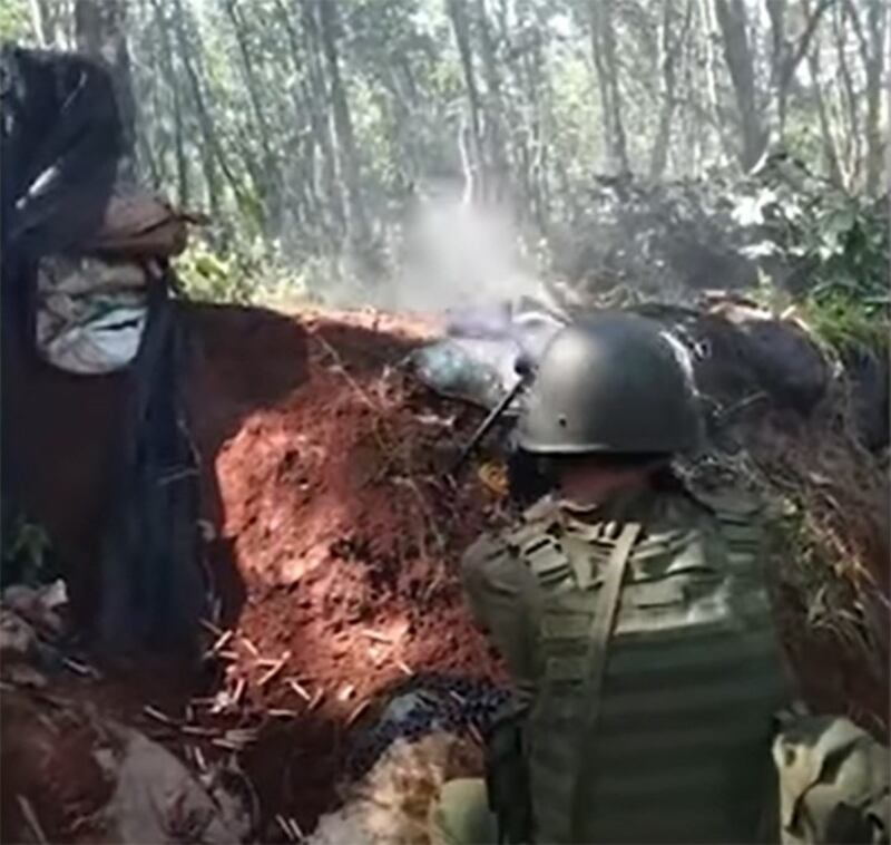 A Kokang Army soldier fires a machine gun during fighting with Myanmar junta forces in this undated photo. Credit: The KoKang