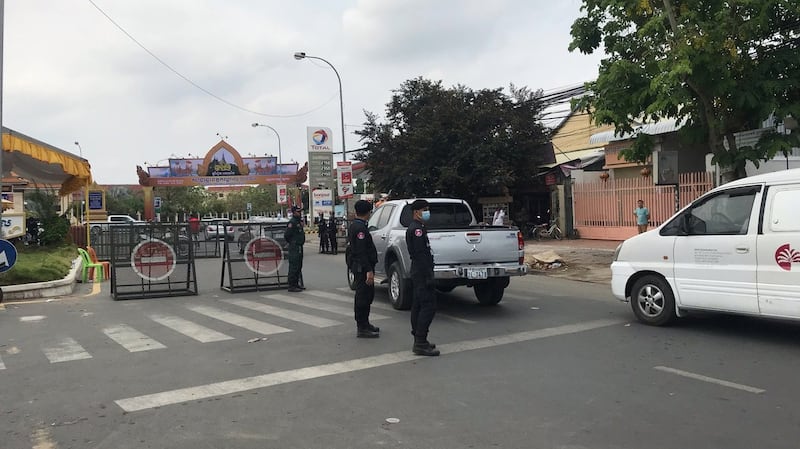 Military Police block a road in Phnom Penh after Hun Sen's travel ban goes into effect, April 10, 2020.