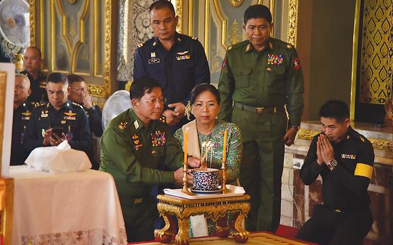 Myanmar junta chief Senior Gen. Min Aung Hlaing and his wife, Kyu Kyu Hla, visit a Buddhist monastery in Thailand in February 2018. (Myanmar military)