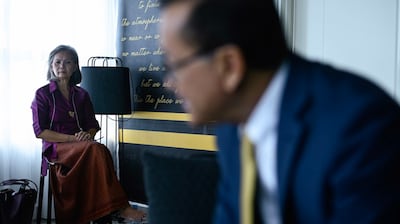 Deputy president of the Cambodia National Rescue Party Mu Sochua (L) listens as the party's acting chief Sam Rainsy speaks during an interview in Kuala Lumpur, Malaysia Nov. 12, 2019.