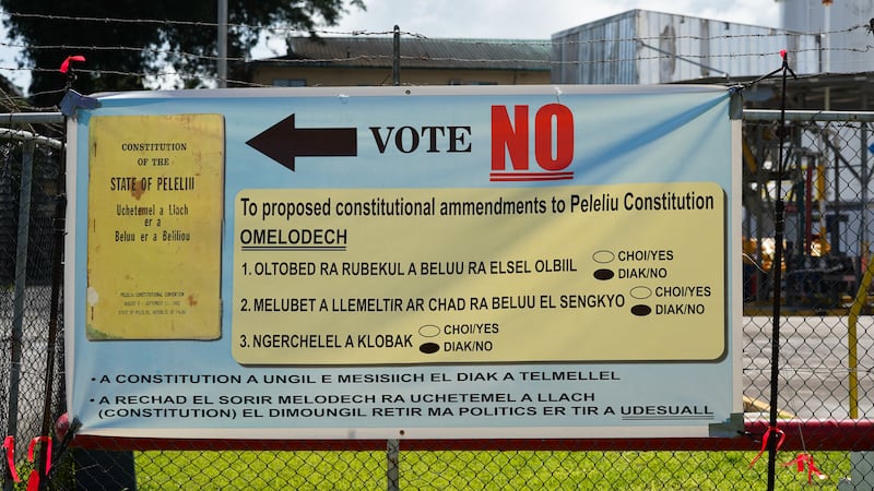 A sign at the ferry dock in the city of Koror calling for a ‘No’ vote against a proposed amendment to the Peleliu constitution, Nov. 25, 2024.