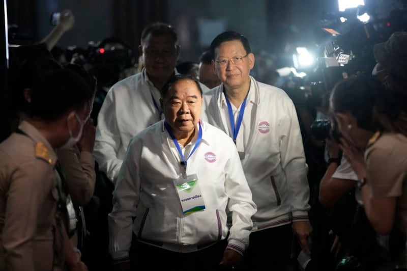 Prawit Wongsuwan (center), then Thailand's deputy prime minister and the prime ministerial candidate of the Palang Pracharath Party, arrives for the drawing of a number as part of the election process for candidates, in Bangkok, April 4, 2023. Credit: Sakchai Lalit/AP