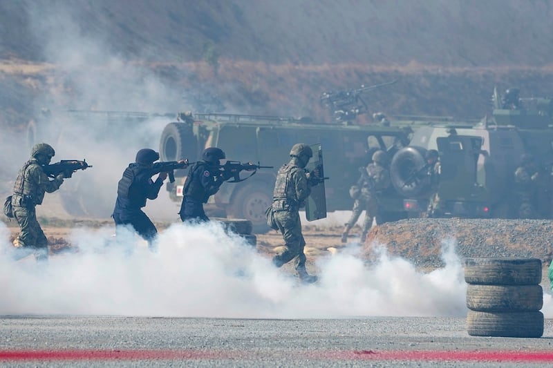 Chinese and Cambodian military personnel participate in the Golden Dragon military exercise in Svay Chok village, north of Phnom Penh May 30, 2024. (Heng Sinith/AP)