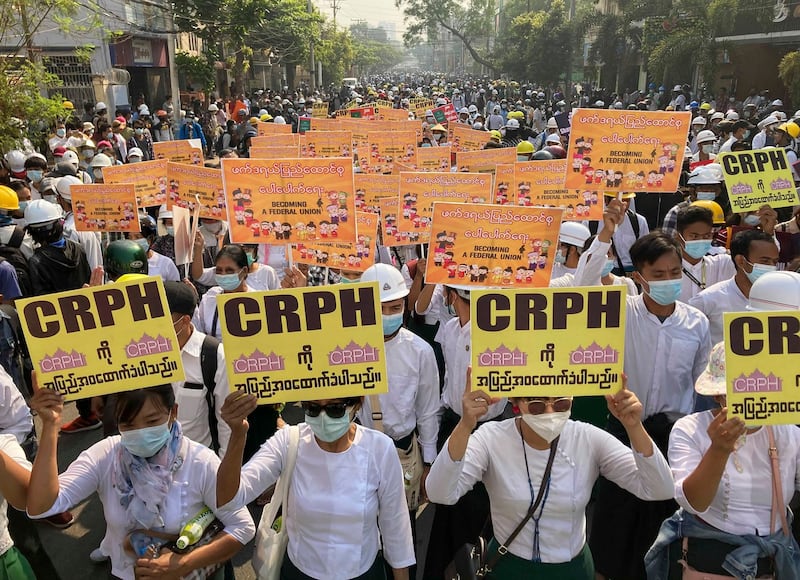 In this March 7, 2021 photo, public health students display placards supporting the CRPH (Committee Representing Pyidaungsu Hluttaw, or Committee of Representatives to the Union Parliament) during a march against the military junta in Mandalay, Myanmar. (AP Photo)