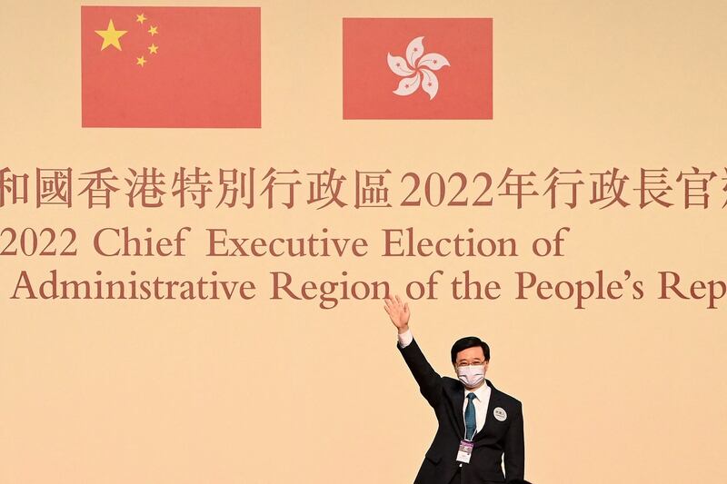 John Lee waves after being elected the city's new chief executive in Hong Kong on May 8, 2022. Credit: AFP