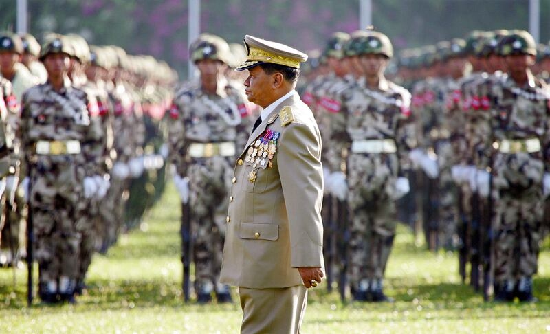 Myanmar former military ruler Senior General Than Shwe reviews troops in Resistance Park on the 60th anniversary of the Myanmar Armed Forces Day in 2005. (Adrees Latif/Reuters)