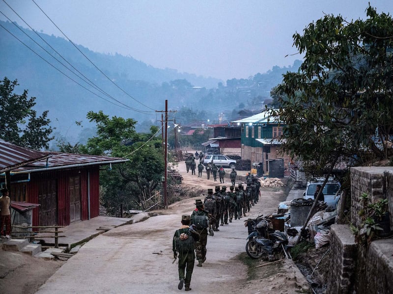 Ta'ang National Liberation Army fighters patrol in northern Shan State, March 9, 2023.