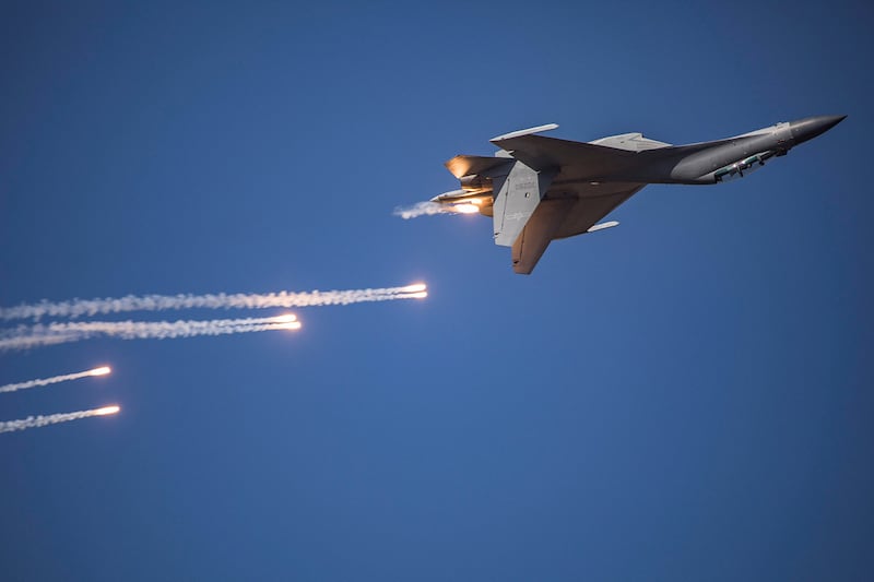 A J-16 fighter jet ejects flares during a performance at the Chinese People's Liberation Army Air Force Aviation Open Day in Changchun, Jilin province, Oct. 17, 2019.