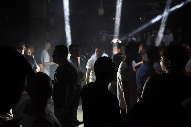 People dance in a gay night club in Beijing, May 11, 2019. While homosexuality was decriminalized in China in 1997, Xi Jinping has ushered in a conservative attitude towards sexuality. (Greg Baker/AFP)