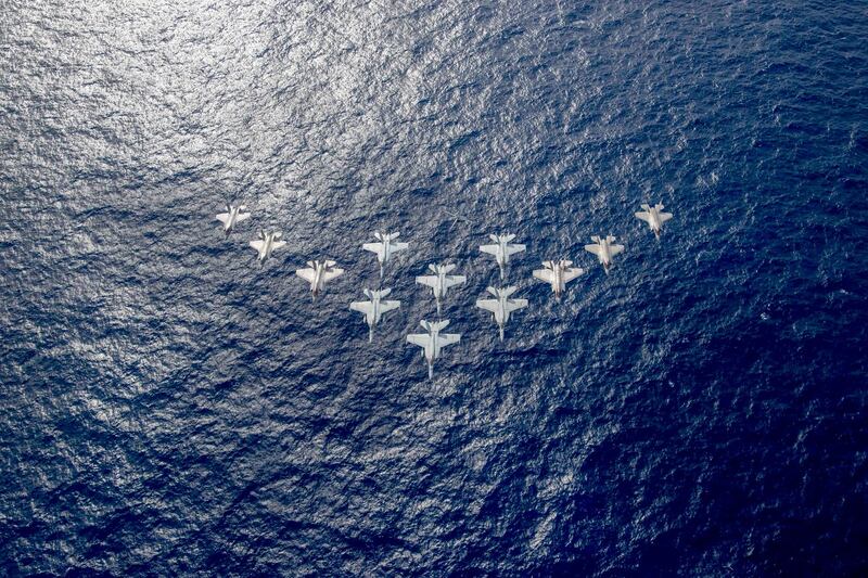 Aircraft from the United Kingdom's carrier strike group led by HMS Queen Elizabeth, and U.S. Navy carrier strike groups led by flagships USS Ronald Reagan and USS Carl Vinson fly in formation during carrier strike group operations in the Philippine Sea, Oct. 3, 2021. Credit: U.S. Navy