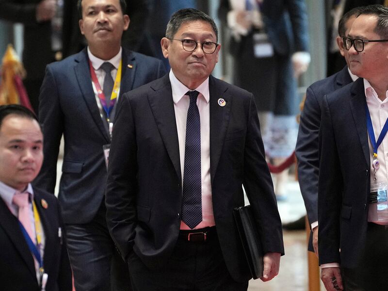 Cambodia Foreign Minister Sok Chenda Sophea, center, walks  during the Association of Southeast Asian Nations Foreign Ministers meeting in Vientiane, Laos, July 25, 2024. (AP Photo/Achmad Ibrahim)