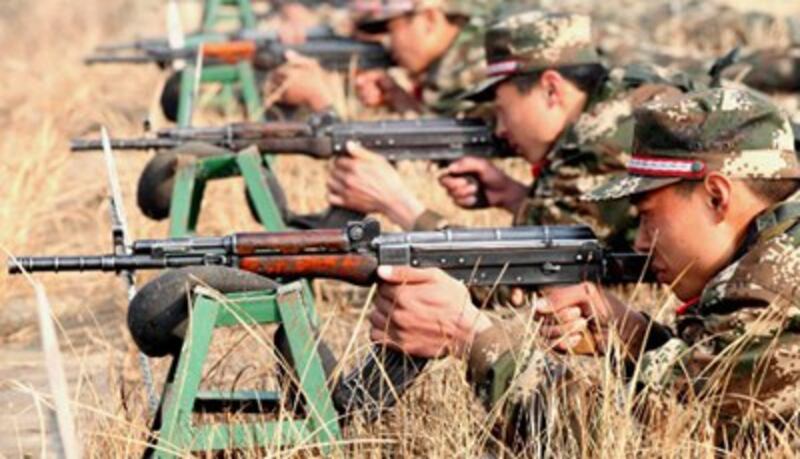 Chinese soldiers take part in gunnery training exercises in Bozhou, eastern China's Anhui province, Dec. 4, 2014.