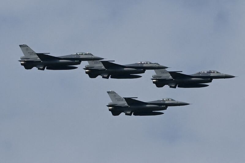 Four upgraded US-made F-16 V fighters fly during a demonstration at a ceremony at the Chiayi Air Force in southern Taiwan, Nov. 18, 2021. Credit: AFP