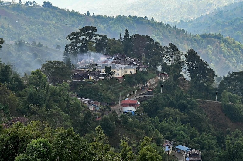 Burning Myanmar military building amid clashes with ethnic armed group Ta'ang National Liberation Army in northern Shan State, Dec. 13, 2023. (AFP Photo)