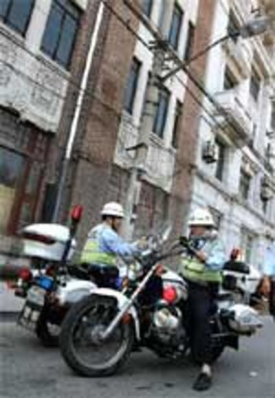 ChinaHousingPolice150.jpg