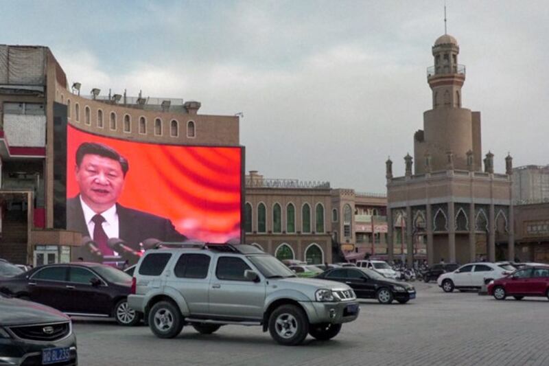 A screen displays Chinese President Xi Jinping near a mosque in Kashgar, northwestern China's Xinjiang region, June 4, 2019. (AFPTV)