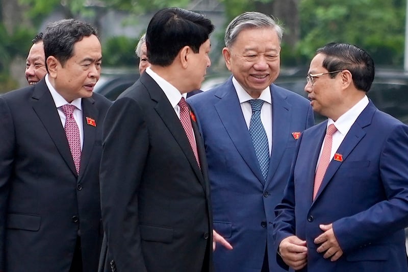 From right: Prime Minister Pham Minh Chinh, Public Security Minister To Lam, Permanent Member of the Secretariat of the Communist Party Luong Cuong and Vice Chairman of the National Assembly Tran Thanh Man talk before a session of the National Assembly in Hanoi, Vietnam, May 20, 2024. (Hau Dinh/AP)