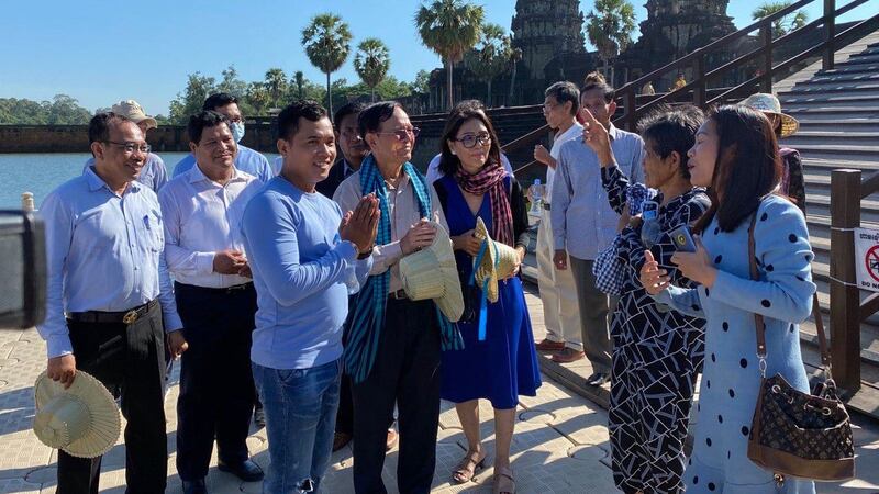 Kem Sokha (C, blue scarf) meets with locals in Siem Reap province, July 19, 2020.