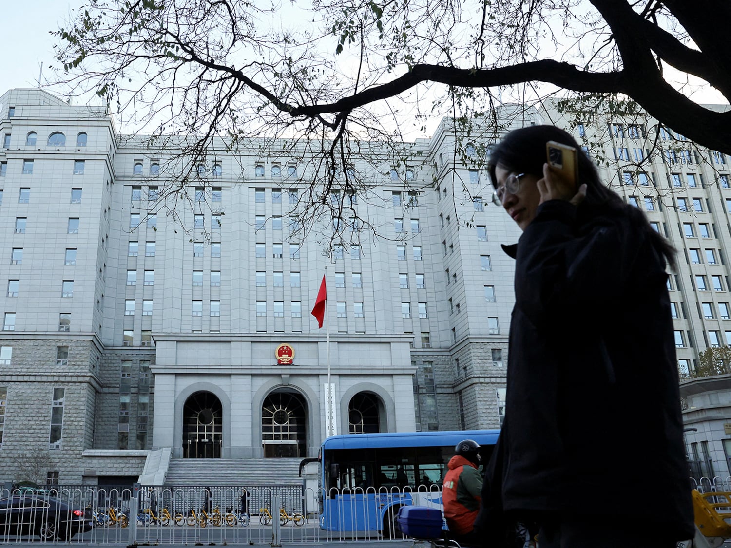 A pedestrian walks past Beijing No. 2 Intermediate People's Court, where former Chinese journalist Dong Yuyu received his verdict for espionage charges, in Beijing, China Nov. 29, 2024.