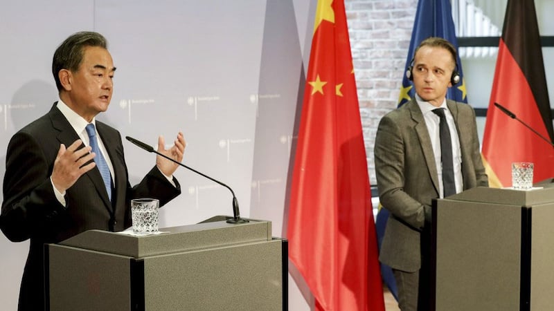 German Foreign Minister Heiko Maas (R) and China's Foreign Minister Wang Yi hold a joint press conference as part of a meeting in Berlin, Sept. 1, 2020.