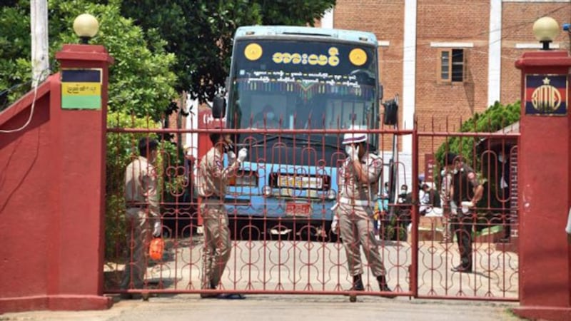 A bus waits to transport newly released prisoners from a correctional facility to their hometowns following a presidential amnesty marking the Buddhist New Year in Lashio, Myanmar's northern Shan state, April 17, 2020.