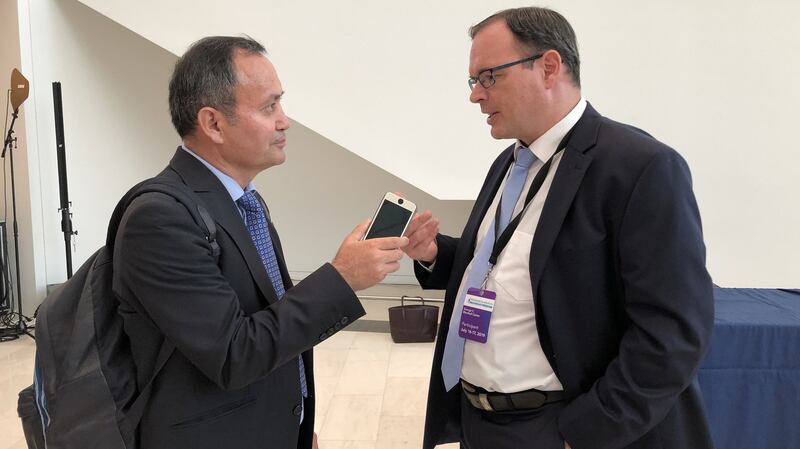 Adrian Zenz (R) speaks with RFA during an interview in Washington, July 17, 2019.