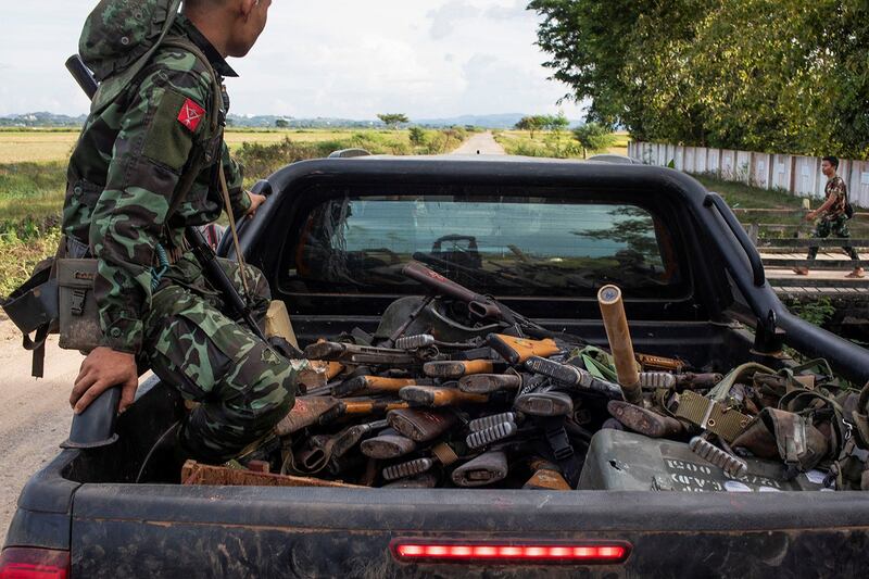 A member of the Karenni Army rides in a truck with seized weapons during a battle in Loikaw in Kayah state, Myanmar, Nov. 12, 2023. (Reuters)