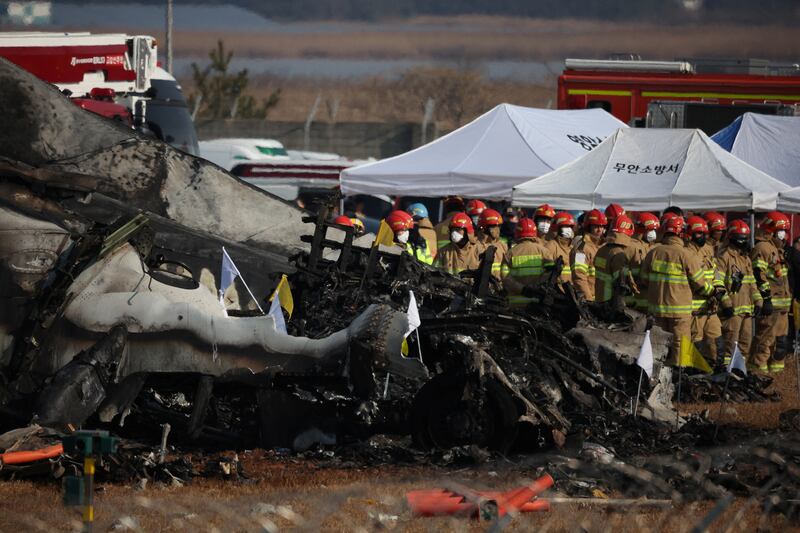 Rescue workers take part in a salvage operation at the site of a plane crash at Muan International Airport, in Muan, South Korea, Dec. 29, 2024.