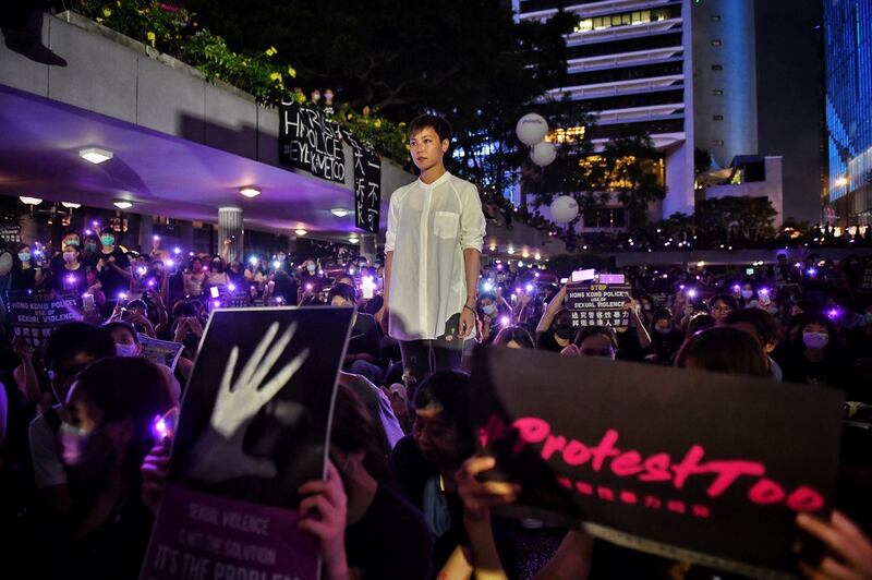 Hong Kong Cantopop singer, actress and LGBT activist Denise Ho posing for a photograph with protesters during a #MeToo rally calling on the Hong Kong police to answer accusations of sexual violence against pro-democracy protesters in Hong Kong, August 28, 2019. Credit: AFP