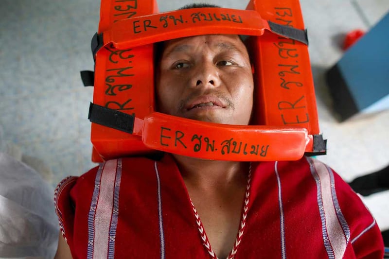 A refugee receives medical treatment Tuesday in Mae Sam Laep. (Reuters)