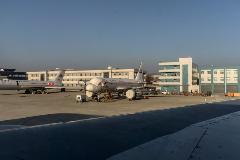 Tupolev Tu-204 aircraft undergoing maintenance at Sunan Pyongyang International Airport